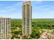 High-rise building featuring an abundance of greenery and an elegant driveway at 750 Park Ne Ave # 19E, Atlanta, GA 30326