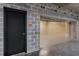 An interior of a two car garage with concrete walls and epoxy flooring at 750 Park Ne Ave # 19E, Atlanta, GA 30326