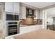 Modern kitchen featuring stainless steel appliances and sleek white cabinetry for a clean, contemporary design at 750 Park Ne Ave # 19E, Atlanta, GA 30326