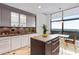 Contemporary kitchen with island, stainless steel appliances, large window and stylish pendant lighting at 750 Park Ne Ave # 19E, Atlanta, GA 30326
