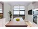 Well-lit kitchen featuring an island, modern appliances, and a large window providing ample natural light at 750 Park Ne Ave # 19E, Atlanta, GA 30326