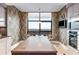 Modern kitchen features stainless steel appliances, a breakfast bar, and a large window with scenic views at 750 Park Ne Ave # 19E, Atlanta, GA 30326