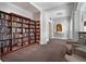 Cozy library nook with floor-to-ceiling bookshelves, filled with books and comfortable seating at 750 Park Ne Ave # 19E, Atlanta, GA 30326