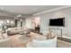 Bright living room with hardwood floors, neutral walls and decor plus a large flat screen TV at 750 Park Ne Ave # 19E, Atlanta, GA 30326