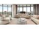 Well-lit living area featuring comfortable seating and floor-to-ceiling windows with a cityscape view at 750 Park Ne Ave # 19E, Atlanta, GA 30326