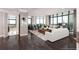 Bright living room with floor to ceiling windows, hardwood floors, and two white sofas with decorative pillows at 750 Park Ne Ave # 19E, Atlanta, GA 30326