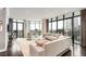 Bright and airy living room with floor to ceiling windows showing city views and neutral decor at 750 Park Ne Ave # 19E, Atlanta, GA 30326