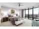 Serene main bedroom with a plush bed, balcony access, and ample natural light, creating a relaxing retreat at 750 Park Ne Ave # 19E, Atlanta, GA 30326
