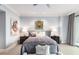 Serene main bedroom with a plush bed, balcony access, and ample natural light, creating a relaxing retreat at 750 Park Ne Ave # 19E, Atlanta, GA 30326
