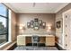 A bright office area with a sleek desk, stylish decor, and a beautiful window view at 750 Park Ne Ave # 19E, Atlanta, GA 30326