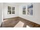 Bright room featuring hardwood floors and large windows offering natural light and outdoor views at 1098 Wedgewood Nw Dr, Atlanta, GA 30318