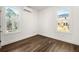 Bright bedroom featuring hardwood floors, large windows, and a split unit AC system at 1098 Wedgewood Nw Dr, Atlanta, GA 30318