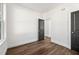 Bedroom featuring hardwood floors, neutral walls, and large windows offering natural light at 1098 Wedgewood Nw Dr, Atlanta, GA 30318