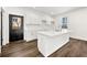 Well-lit kitchen features a large island with a sink, modern cabinets and an exterior door at 1098 Wedgewood Nw Dr, Atlanta, GA 30318