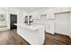 Modern kitchen boasts white cabinets, quartz countertops, and stainless steel faucet, perfect for culinary enthusiasts at 1098 Wedgewood Nw Dr, Atlanta, GA 30318