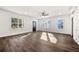 Bright living room features sleek hardwood floors, modern lighting and large windows at 1098 Wedgewood Nw Dr, Atlanta, GA 30318