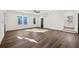 Spacious living room with hardwood floors, large windows, and ample natural light at 1098 Wedgewood Nw Dr, Atlanta, GA 30318