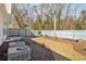 Spacious backyard featuring a well-maintained lawn, mulch beds, and a wooden fence at 1902 Elm Park Dr, Hampton, GA 30228