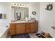 Bathroom featuring a soaking tub, vanity with cabinets, and modern fixtures at 1902 Elm Park Dr, Hampton, GA 30228