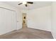 Bedroom with double closets and plush carpet, ready for personalization and comfort at 1902 Elm Park Dr, Hampton, GA 30228