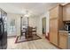 Cozy dining area featuring a ceiling fan, wood table, and door to the backyard at 1902 Elm Park Dr, Hampton, GA 30228