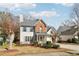 Charming two-story home featuring a mix of brick and siding, complemented by shutters and a landscaped front yard at 1902 Elm Park Dr, Hampton, GA 30228