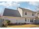 Home exterior with siding, gray roof, and manicured backyard shows its peaceful charm at 1902 Elm Park Dr, Hampton, GA 30228