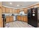Eat-in kitchen showcasing wood cabinets, stainless appliances, and durable countertops at 1902 Elm Park Dr, Hampton, GA 30228