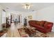 Comfortable living room with an open layout, featuring modern flooring, a fireplace, and a view into the dining space at 1902 Elm Park Dr, Hampton, GA 30228