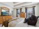 Inviting main bedroom with decorative pillows, large windows, and natural lighting at 1902 Elm Park Dr, Hampton, GA 30228
