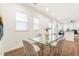 Dining room features lots of light, wood floors, and a glass table with seating for four at 3028 E Point St, Atlanta, GA 30344