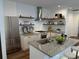 Modern kitchen featuring stainless steel appliances, granite counters, and an island with bar seating at 3028 E Point St, Atlanta, GA 30344