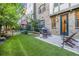 Private back yard featuring artificial turf, a patio, and seating area at 589 Broadview Ne Pl, Atlanta, GA 30324