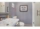 Cozy bathroom featuring a marble countertop sink and a glass-enclosed shower at 589 Broadview Ne Pl, Atlanta, GA 30324