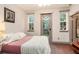 Bright bedroom with hardwood floors and a view to the outside patio through a glass door at 589 Broadview Ne Pl, Atlanta, GA 30324