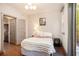 Bedroom featuring a wood framed bed, hardwood floors, and neutral paint at 589 Broadview Ne Pl, Atlanta, GA 30324