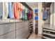 Walk-in closet with custom shelving and drawers for optimal storage and organization at 589 Broadview Ne Pl, Atlanta, GA 30324