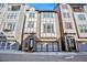 Charming multi-story home with a brick facade, decorative trim, and an attached garage at 589 Broadview Ne Pl, Atlanta, GA 30324