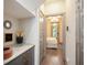 Hallway with view into bedroom, hardwood floors, modern gray tones and attractive decor at 589 Broadview Ne Pl, Atlanta, GA 30324