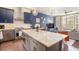 Modern kitchen featuring granite counters, stainless steel appliances, island and hardwood floors at 589 Broadview Ne Pl, Atlanta, GA 30324