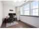 Well-lit home office with hardwood floors, three windows, and ample workspace at 589 Broadview Ne Pl, Atlanta, GA 30324