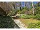 A backyard with a gravel path and stone stairs at 2446 Sunset Ne Dr, Atlanta, GA 30345