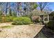 Expansive backyard with lush landscaping, mature trees, and stone walkway at 2446 Sunset Ne Dr, Atlanta, GA 30345