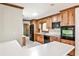 Well-lit kitchen with wooden cabinets, modern appliances, and a white countertop at 2446 Sunset Ne Dr, Atlanta, GA 30345