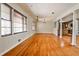 Open-concept living room with hardwood floors, a view of the kitchen, and natural light at 2446 Sunset Ne Dr, Atlanta, GA 30345