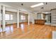 Large living area showcasing hardwood floors that lead to a kitchen and skylight at 2446 Sunset Ne Dr, Atlanta, GA 30345