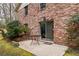 Patio area outside the home with a small table and access to the backyard at 2574 Sugarplum Ne Ct, Atlanta, GA 30345