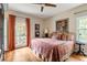 Comfortable bedroom features hardwood floors, natural light, and tasteful decor for relaxation and style at 2574 Sugarplum Ne Ct, Atlanta, GA 30345