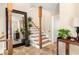 Inviting entryway with flagstone floors, staircase, and oversized mirror at 2574 Sugarplum Ne Ct, Atlanta, GA 30345