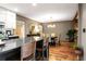 Open floor plan featuring kitchen with kitchen island and dining room with hardwood floors at 2574 Sugarplum Ne Ct, Atlanta, GA 30345